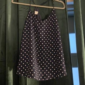 Navy and white polka-dot scalloped tank top purchased from J. Crew.